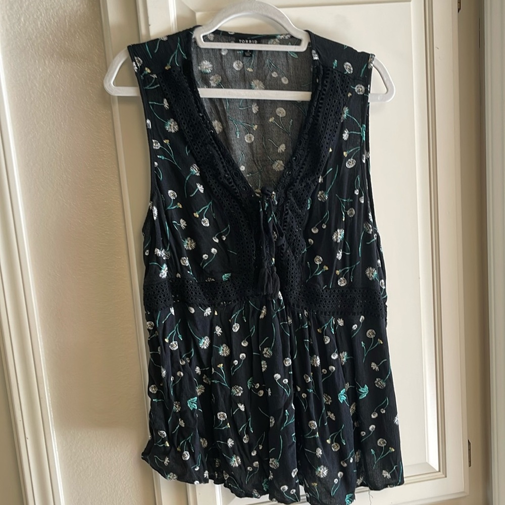 Black floral sleeveless top.